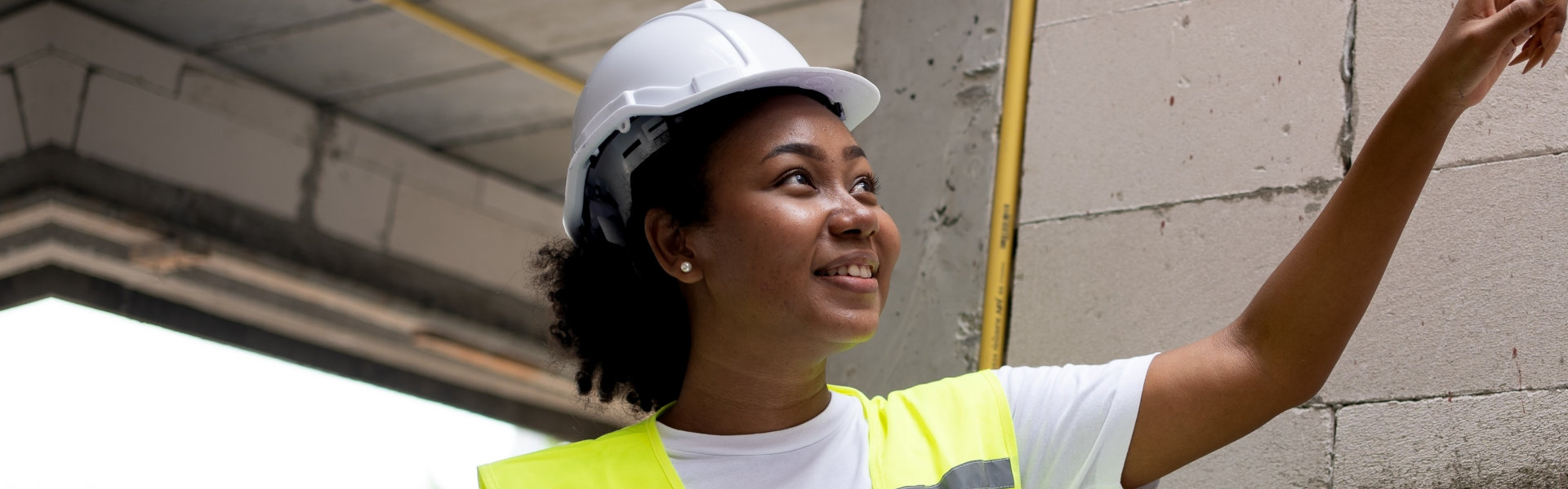 woman worker at construction site Wearing a hard hat