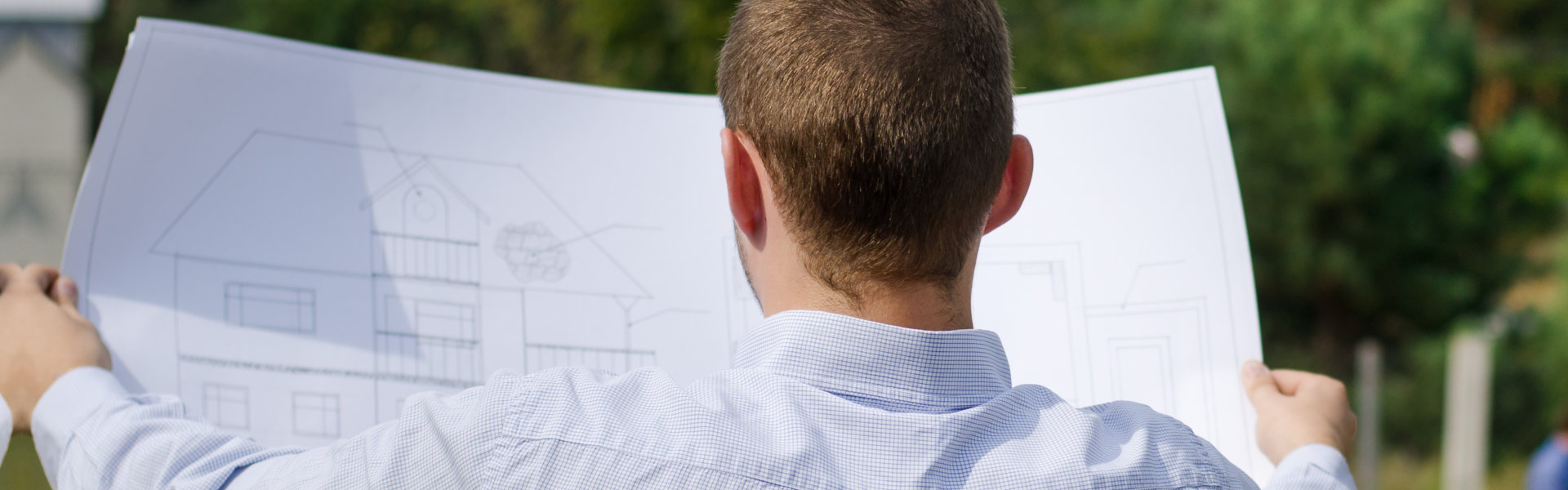 View from behind of a young architect or engineer