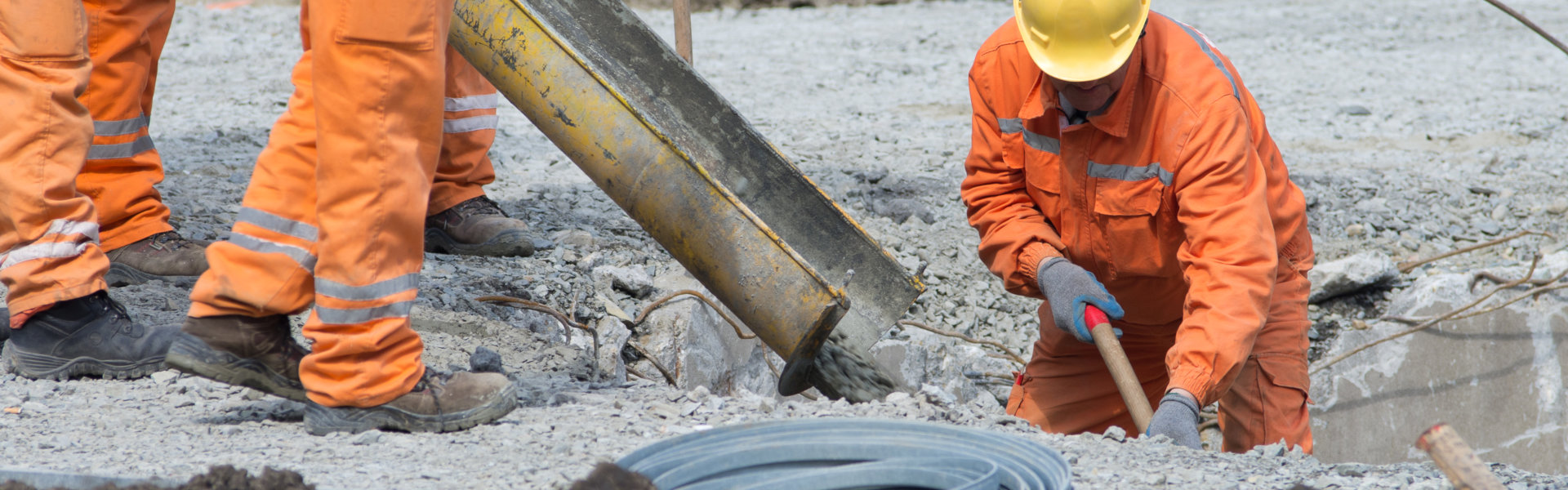 Worker leveling concrete